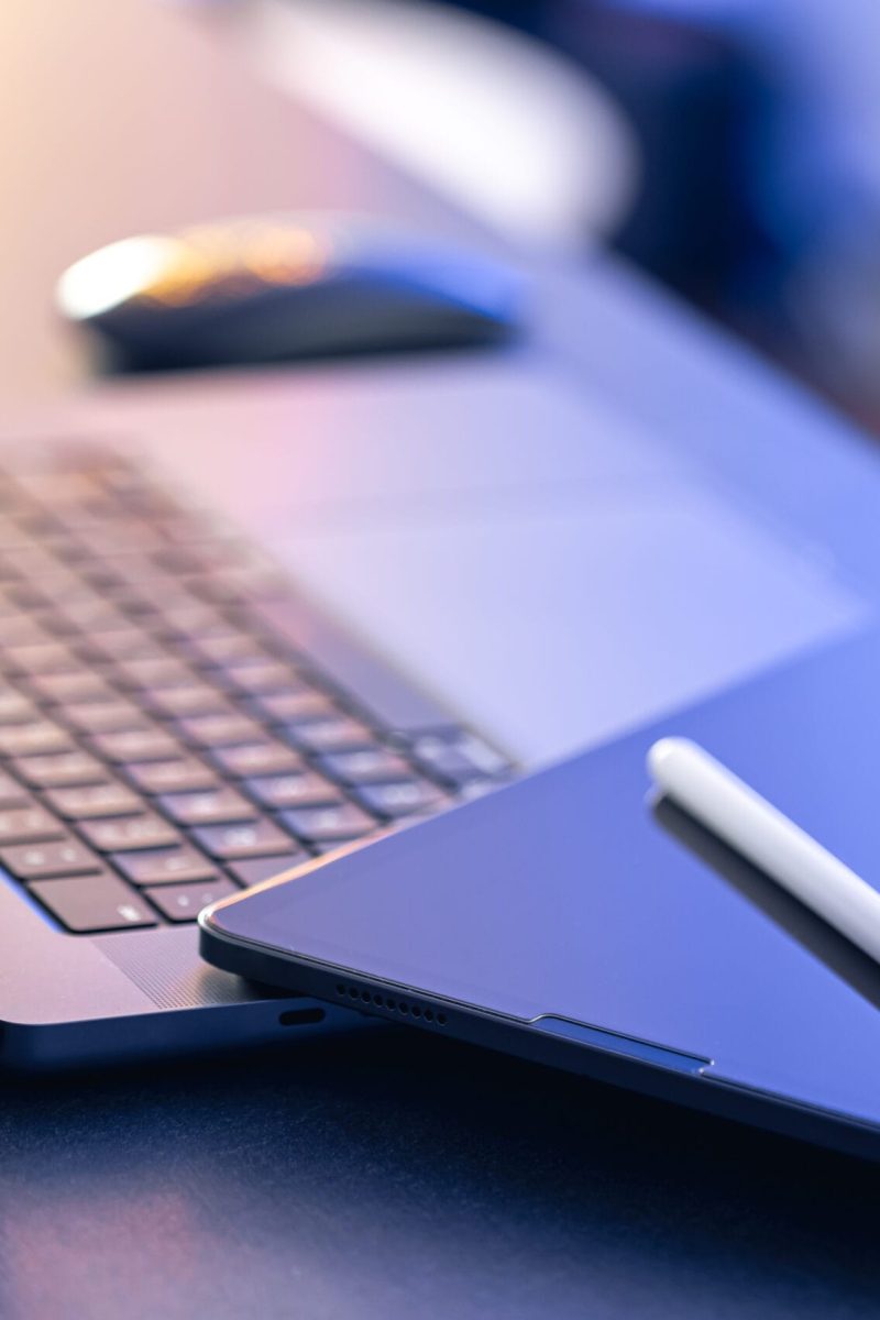 Digital tablet, stylus pen and laptop on the desktop, close up. Digital tablet, stylus pen and laptop on the desktop, close up, business and digital technology concept, copy space.